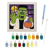 Contenu du kit punch needle monstre Halloween : toile sur cadre, aiguilles et fils de laine