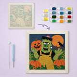 Toile imprimée numérotée à côté du tableau punch needle monstre vert terminé