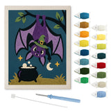 Contenu du kit punch needle chauve-souris : toile sur cadre, aiguilles et fils de laine