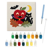 Contenu du kit punch needle pomme vampire : toile sur cadre, aiguilles et fils de laine