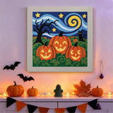 Tableau punch needle trois citrouilles accroché au mur dans une déco d'Halloween