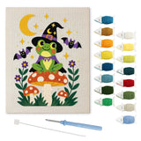 Contenu du kit punch needle rainette amanite : toile sur cadre, aiguilles et fils de laine