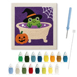Contenu du kit punch needle grenouille Halloween : toile sur cadre, aiguilles et fils de laine