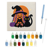 Contenu du kit punch needle sorcière assise : toile sur cadre, aiguilles et fils de laine