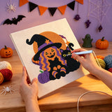 Broderie punch needle en cours, aiguille en main, sur la toile de la sorcière et du chat