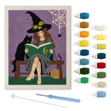 Contenu du kit punch needle sorcière et chat : toile sur cadre, aiguilles et fils de laine