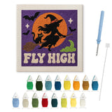 Contenu du kit punch needle sorcière volante : toile sur cadre, aiguilles et fils de laine