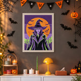 Tableau punch needle sorcière devant la lune orange accroché au mur dans une déco d'Halloween