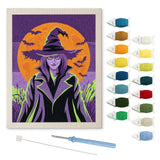 Contenu du kit punch needle sorcière néon : toile sur cadre, aiguilles et fils de laine