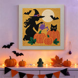 Tableau punch needle sorcière qui arrose ses citrouilles, accroché au mur pour Halloween