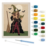 Contenu du kit punch needle sorcière rétro : toile sur cadre, aiguilles et fils de laine