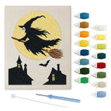 Contenu du kit punch needle sorcière village : toile sur cadre, aiguilles et fils de laine