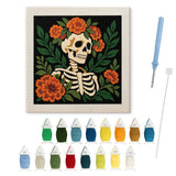 Contenu du kit punch needle squelette bohème : toile sur cadre, aiguilles et fils de laine