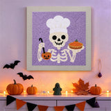 Tableau punch needle squelette chef accroché au mur dans une déco d'Halloween