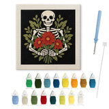 Contenu du kit punch needle squelette galant : toile sur cadre, aiguilles et fils de laine