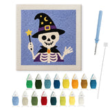 Contenu du kit punch needle Halloween squelette mage : toile sur cadre, aiguilles et fils de laine