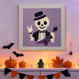 Tableau punch needle squelette rock accroché au mur dans une déco d'Halloween