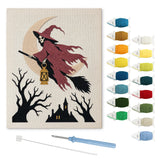 Contenu du kit punch needle squelette volant : toile sur cadre, aiguilles et fils de laine