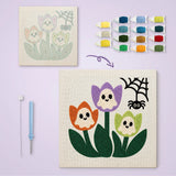 Toile imprimée numérotée à côté du tableau punch needle tulipes terminé