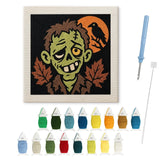 Contenu du kit punch needle zombie corbeau : toile sur cadre, aiguilles et fils de laine